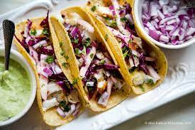 Baja fish tacos, a meal we could eat for days. Fish Tacos With Cabbage Kohlrabi Slaw And Avocado Crema The Clean Food Club