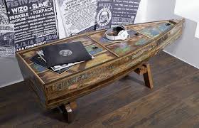 If you are in the business of selling boats or canoes, your office screams for this. Boat Coffee Table Original And Eye Catching Furniture Piece For Your Home