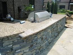 Stacked stone outdoor kitchen for spring. Add Natural Stone To Your Outdoor Kitchen Moreno Granite