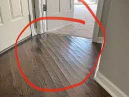how to fix swollen wood floor without