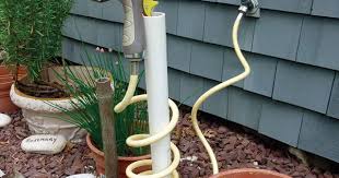 fine gardening coiled hose holder from