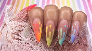 rainbow drip nail art design using