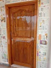 brown hinged designer wooden door