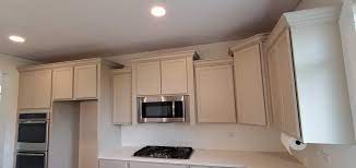 how to clean kitchen cabinets before