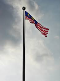 Red, yellow, and black horizontal stripes with white disc bearing. List Of Malaysian Flags Wikipedia