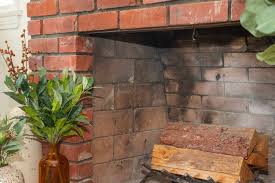 how to clean soot off brick fireplaces