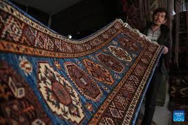 feature afghans in carpet industry