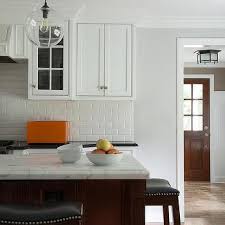 white kitchen with cherry island design