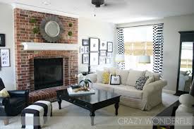 living room with brick fireplace the