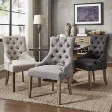 benchwright on tufted wingback chairs