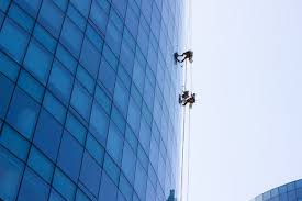 window cleaning workers hanging outside