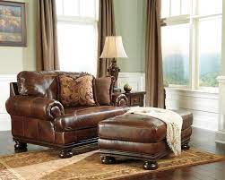 Ashley furniture — peeling leather couch. Ashley Traditional Genuine Top Grain Leather Brown Chair And A Half And Ottoman Ashleyfurniture Traditionalclas Furniture Ashley Furniture Living Room Chairs