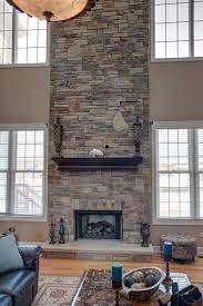 Two Story Stone Fireplace In Home