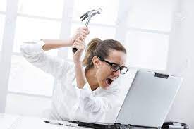 Freaked Out Business Woman With A Hammer Ready To Smash Her Laptop Computer  Stock Photo, Picture And Royalty Free Image. Image 17799970.