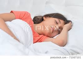 cute little girl sleeping in bed at