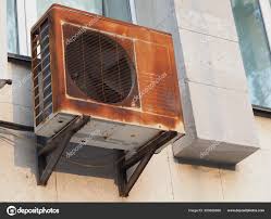 old rusty outdoor air conditioner unit