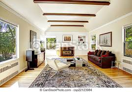 vaulted ceiling with brown beams in