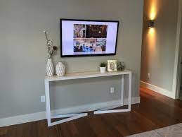 white table and wall mounted tv