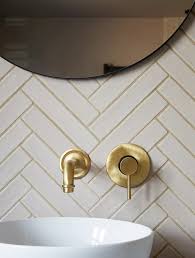 White Herringbone Tiles In Bathroom