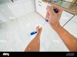 POV View Of A Woman Maid Hand Mopping The Floor In Kitchen At Home Stock  Photo - Alamy