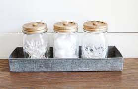 This walk through shows what to buy, and how to put them all together! Decorative Mason Jar Bathroom Storage Little House Of Four Creating A Beautiful Home One Thrifty Project At A Time Decorative Mason Jar Bathroom Storage