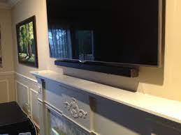 By connecting the soundbar to the tv's optical port, you'll be able to hear all tv sound automatically through the soundbar. Samsung Sound Bar Installed Flush Against The Front Surface Of The Tv Using Sound Bar Brackets And Some Spacers To Sound Bar Wall Mount Sound Bar Soundbar Wall