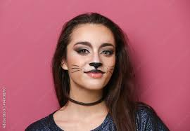 cat makeup on color background stock