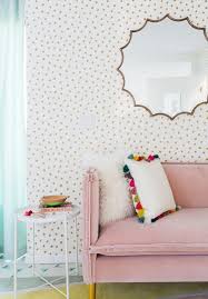 pink velvet sofa polka dot wallpaper
