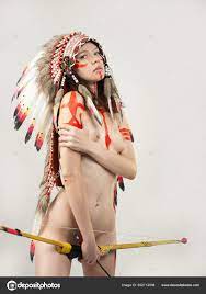Naked woman in native american costume with feathers Stock Photo by  ©artrotozwork 502712598