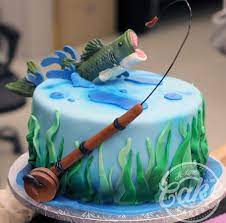 Use blue buttercream to attach fins, tail tip, and eyeballs to body. Fishing Themed Birthday Groomsmen Cake Fish Jumping Out Of Water Cake