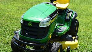 With the gas tank empty, turn the mower on its side. John Deere E160 Lawn Tractor Review Powerful Yard Machine