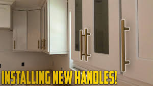 install new handles on kitchen cabinets