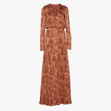 The sleeves are sheer so you won't get too warm, but the high neck and midi length offer a little extra coverage for chillier months. Best Fall Wedding Guest Dresses Vogue