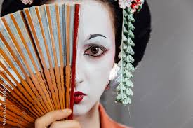 woman in geisha makeup and a