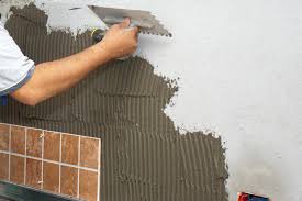 Do You Put Adhesive On Tile Or Wall