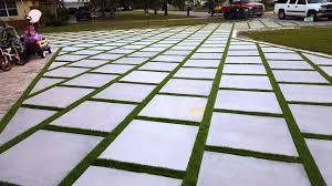If you decide to do this it's important you know step 9 secure the edges of the grass. Miami Artificial Turf Turf Strips Grass Between Concrete Slab Artificial Tur Artificial Grass Patio Artificial Grass Installation Artificial Grass Backyard