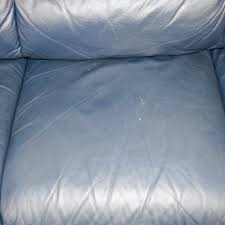 navy blue leather three cushion sofa