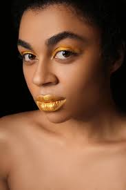 golden makeup on black background