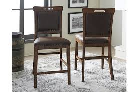 Practical faux leather has a charmingly vintage tone. Royard Counter Height Bar Stool Ashley Furniture Homestore