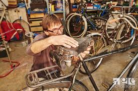 technician restoring a vine bicycle
