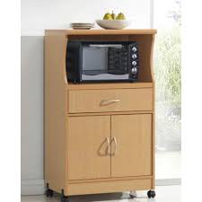 Placing the microwave inside a cabinet or appliance garage hides the microwave behind a door that blends with the rest of the cabinetry when the appliance is not in use. Beech Wood Microwave Cart Kitchen Cabinet With Wheels And Storage Drawer Fastfurnishings Com