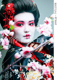 young pretty geisha in black kimono
