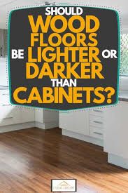 Generally, it is much better to install the hardwood floors before the kitchen cabinets. Should Wood Floors Be Lighter Or Darker Than Cabinets Home Decor Bliss