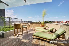Let's check the top 9 different types of deck chairs Lounge Chairs On Rooftop Balcony In Modern Apartment Building High Rise Architecture Stock Photo 254636810