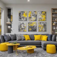 gray couch and yellow pillows