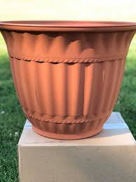 I was inspired by this little pot (above) and decided to imitate the pattern etched into the pottery on the nypon grey recycled plastic plant pots. Flower Pot Makeover With Spray Paint My Sweet Home Living