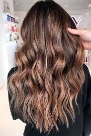 The short hair with choppy ends has a dark brown undertone bleached with caramel hue on the top making the whole look very strong. Highlighted Hair For Brunettes Lovehairstyles Com