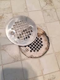 shower has a drain below the tile