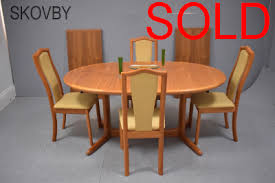skovby dining suite of extendable table