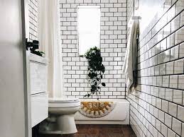 A background of vibrant yellow tiles framed by cream subway tiles is a guaranteed way to make a sunny statement in the bathroom. 16 Subway Tile Bathroom Ideas To Inspire Your Next Remodel